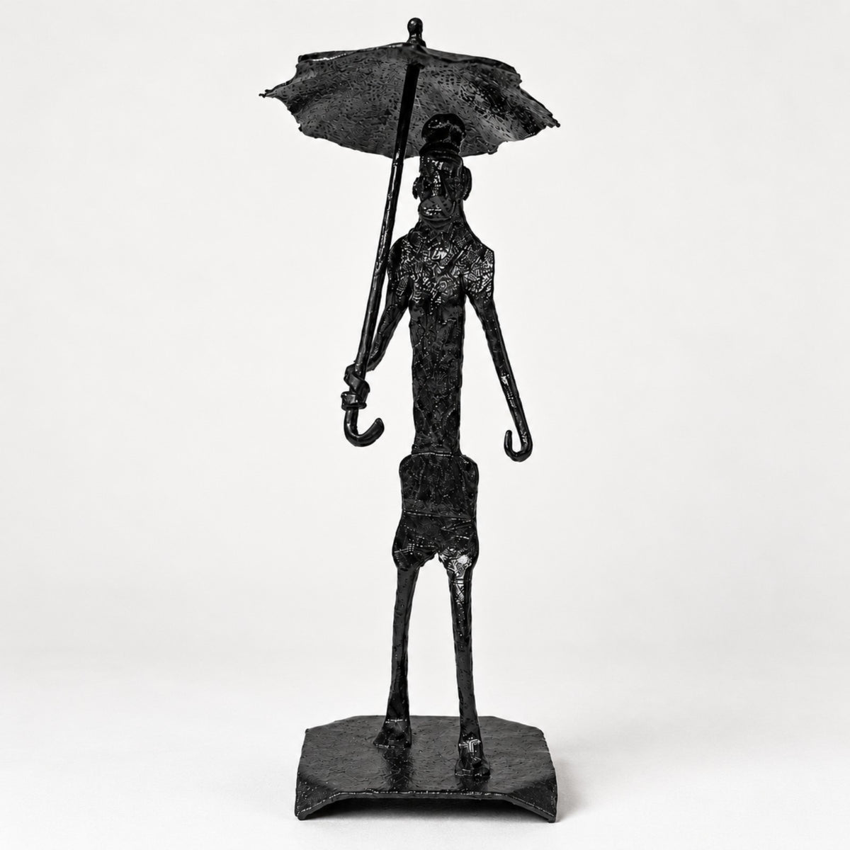 Sthula's Handmade Black Metal Man With Umbrella Figurine